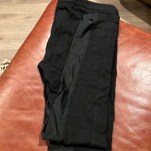 Bebe Black leggings. Sheer panel throughout inner thigh. New